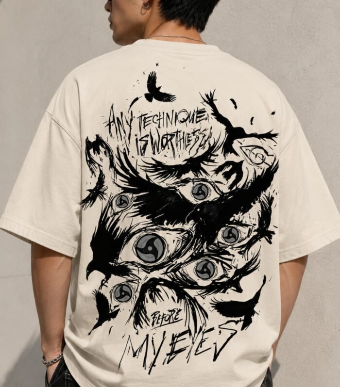 Man wearing LURI Before My Eyes oversized t-shirt back – dark anime Sharingan eyes and crows graphic on cream Supima cotton